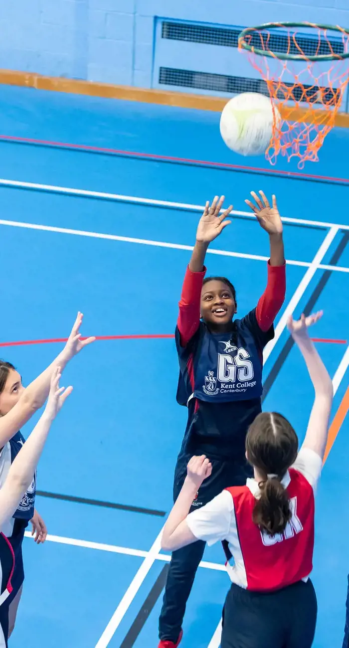 Senior school pupils playing netball