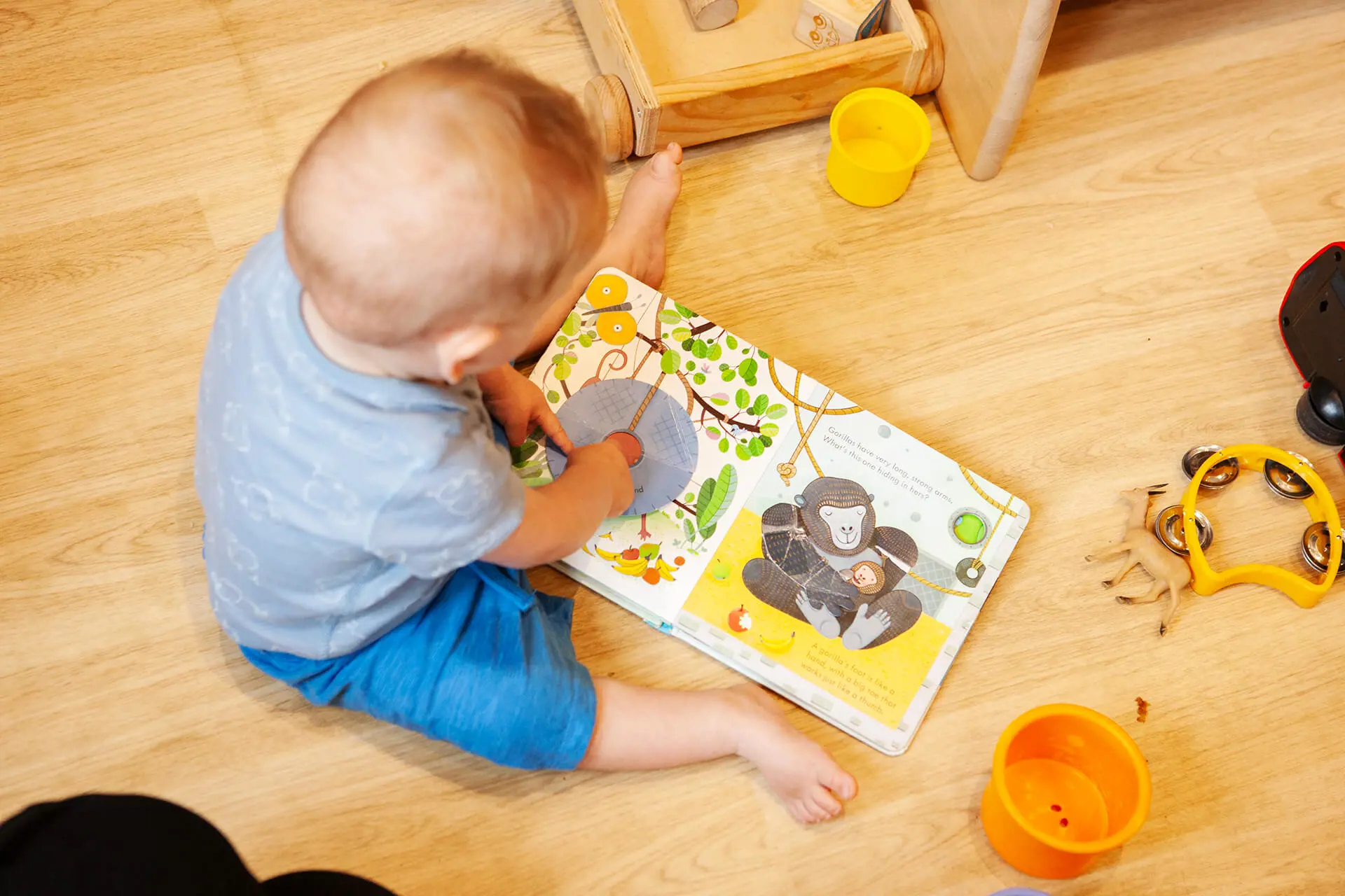 Nursery pupil with a book