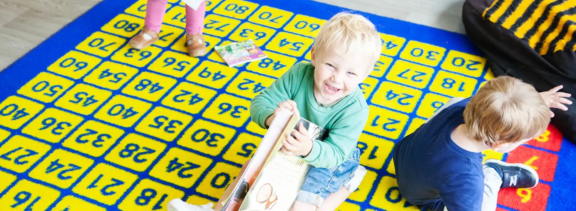 Nursery pupil on the playmat at Garden Cottage Nursery, Canterbury