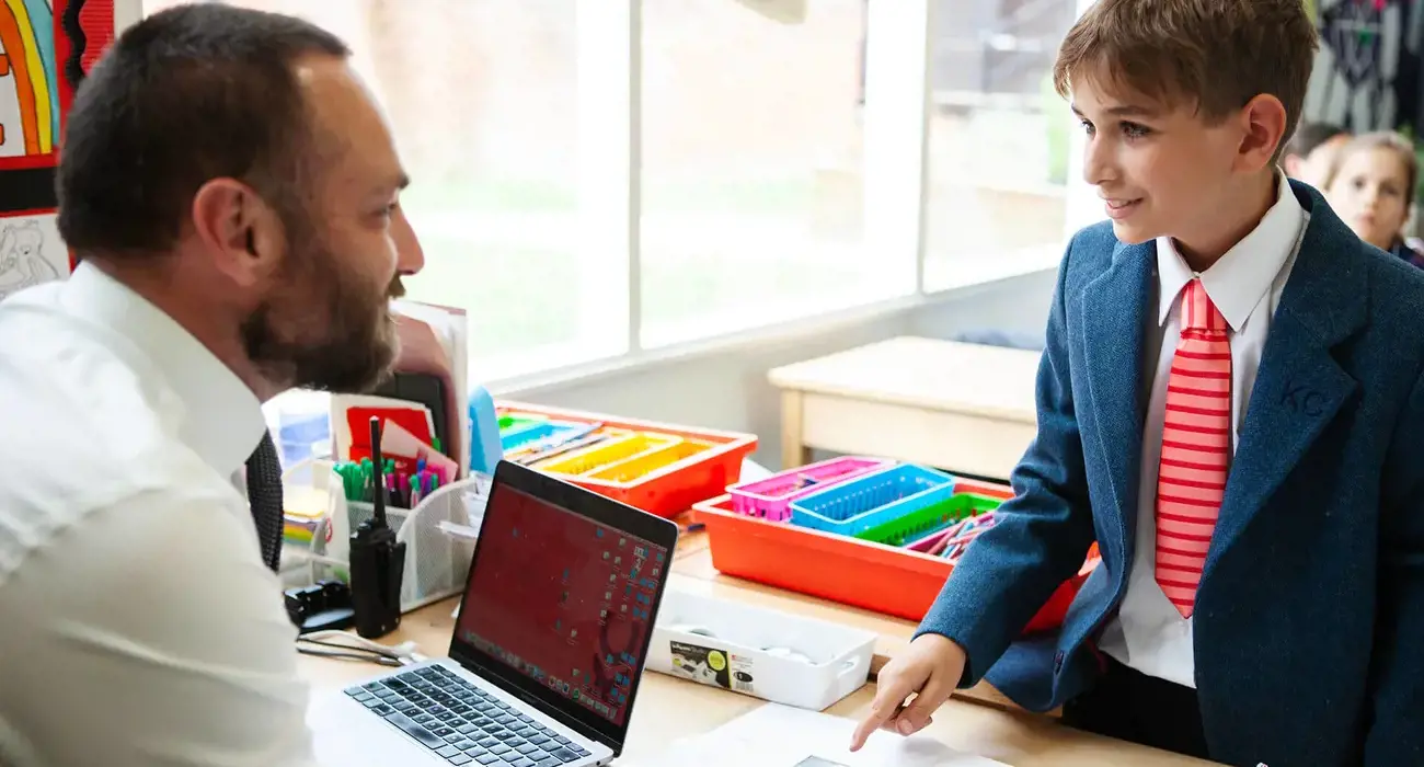 Teacher and pupil in class