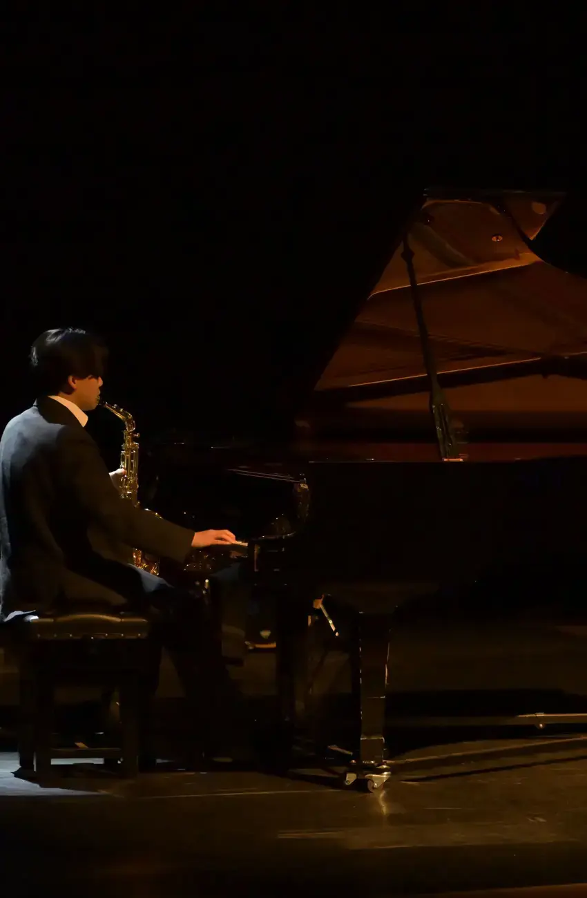 A student at Kent College playing the piano